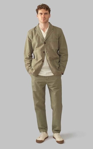 Olive Suit Outfits: Such essentials as an olive suit and a white polo are an easy way to inject some manly elegance into your casual styling rotation. For something more on the daring side to round off your getup, complement this ensemble with beige canvas low top sneakers.
