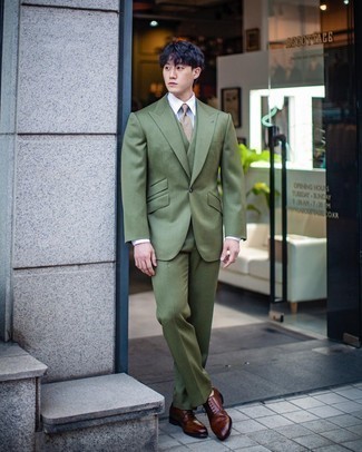 Olive Three Piece Suit Outfits: This pairing of an olive three piece suit and a white dress shirt epitomizes sophistication and class. For something more on the daring side to complete this look, complete this getup with a pair of brown leather brogues.
