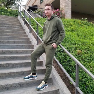 Olive Track Suit Outfits For Men: The best foundation for a kick-ass laid-back outfit? An olive track suit. Unimpressed with this outfit? Introduce a pair of multi colored athletic shoes to change things up a bit.