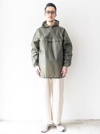 Olive Windbreaker Outfits For Men: Choose an olive windbreaker and white chinos to pull together an everyday look that's full of style and character. Let your outfit coordination credentials really shine by completing this ensemble with white athletic shoes.