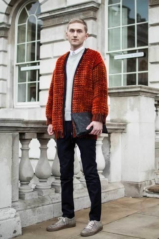 Orange Cardigan Outfits For Men: If the situation allows casual style, you can wear an orange cardigan and navy chinos. Finishing with black and white horizontal striped canvas low top sneakers is a guaranteed way to inject a carefree feel into your outfit.
