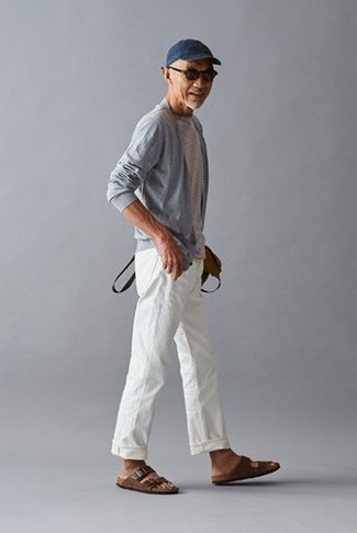 Brown Leather Sandals Outfits For Men: Pairing a grey open cardigan and white chinos will be a true manifestation of your prowess in men's fashion even on off-duty days. For shoes, you could follow the casual route with a pair of brown leather sandals.