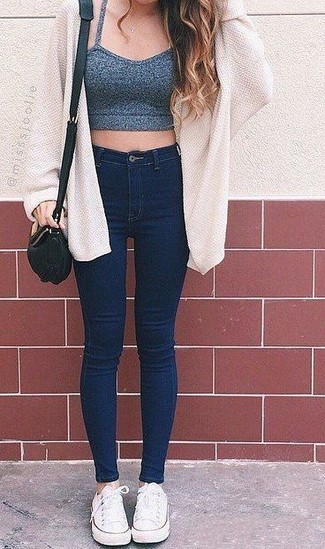 White Canvas Low Top Sneakers Outfits For Women: Prove your outfit coordination savvy by teaming a white open cardigan and navy skinny jeans for a casual combination. A chic pair of white canvas low top sneakers is an easy way to give an air of playfulness to this ensemble.