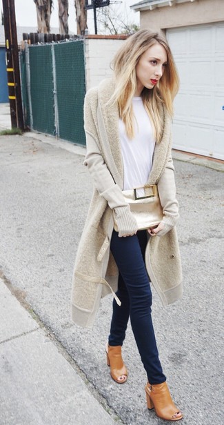 Beige Leather Ankle Boots Outfits: Why not wear a beige open cardigan with navy skinny jeans? Both of these pieces are super comfortable and look wonderful teamed together. To bring a bit of fanciness to this ensemble, introduce beige leather ankle boots to this look.