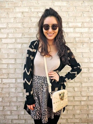 Beige Leopard Skater Skirt Outfits: This pairing of a black chevron open cardigan and a beige leopard skater skirt is proof that a pared down casual look can still look totaly chic.