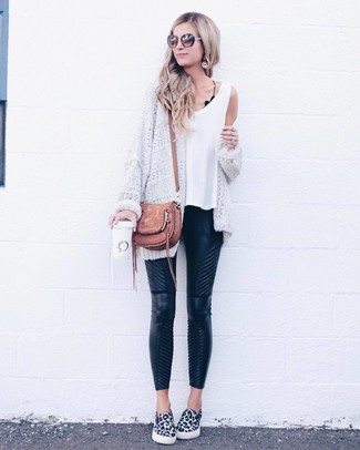 Brown Crossbody Bag Outfits: This pairing of a white knit open cardigan and a brown crossbody bag combines comfort and confidence and helps keep it simple yet trendy. Balance out this look with a dressier kind of footwear, like this pair of white and black leopard slip-on sneakers.