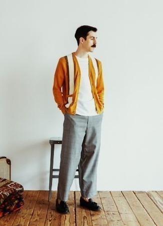Grey Chinos Outfits: This pairing of an orange cardigan and grey chinos will hallmark your expertise in menswear styling even on lazy days. Puzzled as to how to finish this look? Round off with black leather tassel loafers to polish it off.