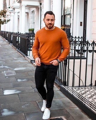 Orange Crew-neck Sweater Outfits For Men: Wear an orange crew-neck sweater with black skinny jeans for both sharp and easy-to-style outfit. Complete your outfit with a pair of white canvas low top sneakers for maximum effect.