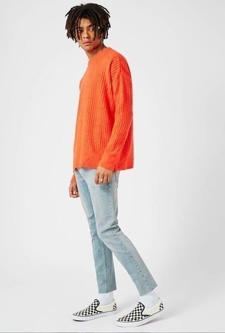 Black Canvas Slip-on Sneakers Outfits For Men: This combo of an orange crew-neck sweater and light blue jeans is indisputable proof that a safe casual getup doesn't have to be boring. Introduce black canvas slip-on sneakers to the mix and the whole outfit will come together.