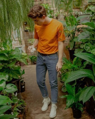 Orange Crew-neck T-shirt Outfits For Men: This pairing of an orange crew-neck t-shirt and blue jeans is hard proof that a simple casual ensemble can still look really stylish. And if you wish to easily dress down your look with one single piece, add a pair of white canvas high top sneakers to this ensemble.