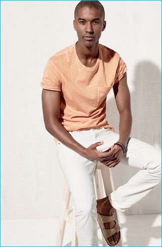 Tan Suede Sandals Outfits For Men: The versatility of an orange crew-neck t-shirt and white jeans means you'll always have them on high rotation in your menswear arsenal. A pair of tan suede sandals will give a carefree touch to your getup.
