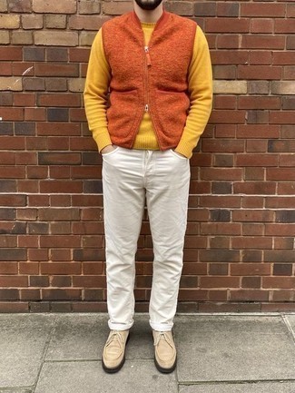 Mustard Crew-neck Sweater Outfits For Men: A mustard crew-neck sweater and white jeans are both versatile menswear essentials that will integrate really well within your day-to-day arsenal. Beige suede desert boots are a good choice to complete this ensemble.