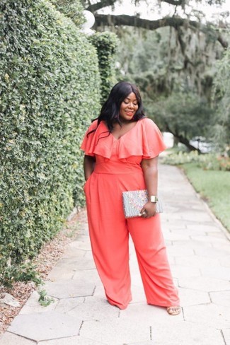 Rock an orange jumpsuit for an off-duty and trendy look. You can get a little creative when it comes to shoes and lift up your ensemble by sporting tan leather heeled sandals.