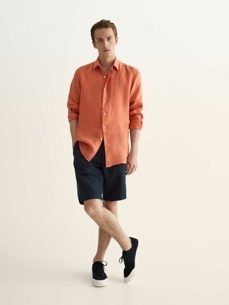 Orange Long Sleeve Shirt Outfits For Men: For dapper menswear style without the need to sacrifice on functionality, we love this combo of an orange long sleeve shirt and navy shorts. Complete this getup with a pair of black canvas low top sneakers and ta-da: the ensemble is complete.