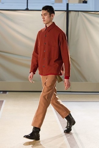 Orange Long Sleeve Shirt Outfits For Men: To pull together an off-duty getup with a modern twist, you can easily opt for an orange long sleeve shirt and tobacco chinos. If you need to easily perk up your outfit with a pair of shoes, introduce a pair of black leather chelsea boots to this getup.