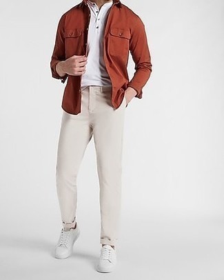 Orange Long Sleeve Shirt Outfits For Men: If you love off-duty combinations, then you'll love this combo of an orange long sleeve shirt and beige chinos. Complement your outfit with a pair of white leather low top sneakers to easily amp up the appeal of this outfit.
