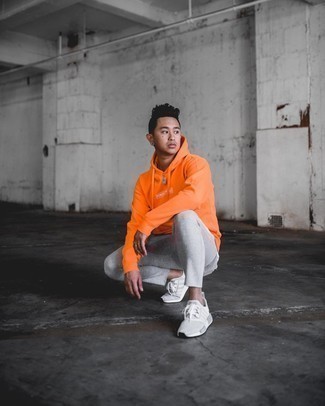 Orange Print Hoodie Outfits For Men: An orange print hoodie and grey sweatpants are an off-duty combo that every trendsetting gentleman should have in his menswear collection. A pair of grey athletic shoes can integrate brilliantly within a great deal of combinations.