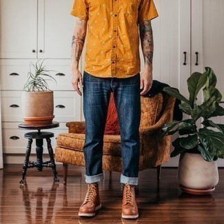 Orange Print Short Sleeve Shirt Outfits For Men: Go for a simple but laid-back and cool choice by wearing an orange print short sleeve shirt and navy jeans. Make this look a bit sleeker by rounding off with a pair of tobacco leather casual boots.