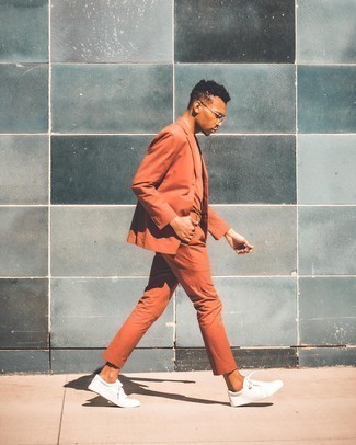 Orange Suit Outfits: For an ensemble that's worthy of a modern sartorially savvy gentleman and effortlessly sleek, consider pairing an orange suit with an orange crew-neck t-shirt. Our favorite of an infinite number of ways to complement this outfit is white canvas low top sneakers.