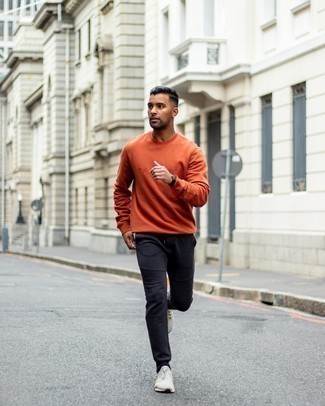 Black Sweatpants Outfits For Men: If you're looking for a relaxed but also on-trend outfit, pair an orange sweatshirt with black sweatpants. Slip into a pair of grey athletic shoes to bring an element of stylish effortlessness to your ensemble.