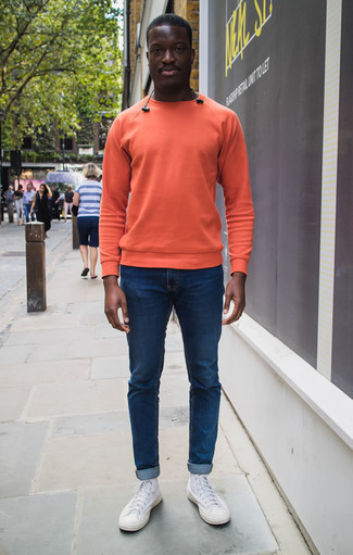 Yellow Sweatshirt Outfits For Men: This pairing of a yellow sweatshirt and navy jeans is ridiculously stylish and yet it's easy and ready for anything. Add a carefree vibe to this ensemble by wearing white canvas high top sneakers.