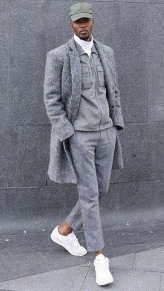Grey Overcoat Outfits: This is indisputable proof that a grey overcoat and grey wool dress pants look awesome when paired together in a polished ensemble for a modern man. Introduce a pair of white athletic shoes to the mix to add an element of stylish effortlessness to your ensemble.