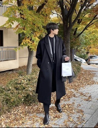 Chelsea Boots Outfits For Men: This smart combo of a black overcoat and black chinos is capable of taking on different forms depending on how you style it. Breathe an added dose of refinement into this outfit by finishing with chelsea boots.