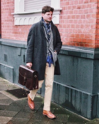 Bag Outfits For Men: For a relaxed look, dress in a charcoal herringbone overcoat and a bag — these pieces play nicely together. For a smarter finish, why not complete this getup with a pair of tobacco leather brogue boots?