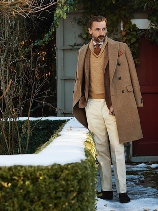 253 Dressy Winter Outfits For Men: Dress in a camel overcoat and white dress pants and you'll look like a true style expert. We're loving how complete this outfit looks when completed with a pair of dark brown suede oxford shoes. During the winter season, when comfort is a must, it can be easy to settle for a less-than-stylish look in the name of practicality. But this look is a clear example that you totally can stay snug and remain stylish during the winter season.