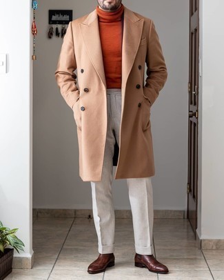 Orange Wool Turtleneck Outfits For Men: You're looking at the indisputable proof that an orange wool turtleneck and white dress pants look amazing if you pair them together in a refined ensemble for today's guy. Let your sartorial skills really shine by complementing your outfit with a pair of dark brown leather chelsea boots.