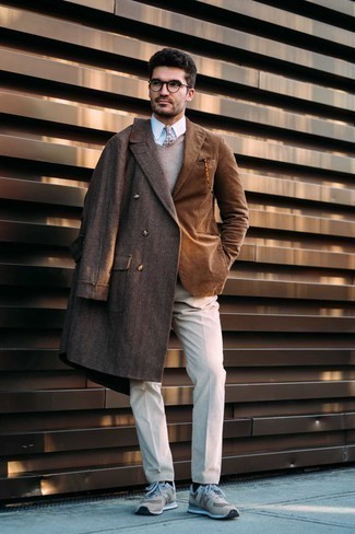Dark Brown Plaid Overcoat Outfits: This is undeniable proof that a dark brown plaid overcoat and beige dress pants look awesome when combined together in a classy look for a modern gentleman. Balance out this look with a more relaxed kind of shoes, like these beige athletic shoes.