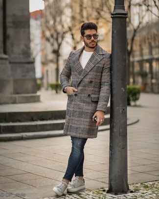 Navy Ripped Skinny Jeans Outfits For Men: If you're on the lookout for a relaxed but also dapper outfit, dress in a charcoal plaid overcoat and navy ripped skinny jeans. If you need to easily kick up your outfit with a pair of shoes, why not complete this outfit with grey leather low top sneakers?