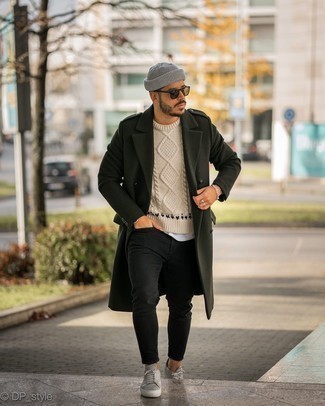 Tan Cable Sweater Outfits For Men: You're looking at the irrefutable proof that a tan cable sweater and black skinny jeans are amazing when married together in a laid-back look. Grey leather low top sneakers fit right in here.