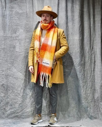 Orange Check Scarf Outfits For Men: A yellow overcoat and an orange check scarf married together are a sartorial dream for those who love cool and casual getups. If you need to effortlessly dress down this look with shoes, why not introduce olive athletic shoes to the mix?