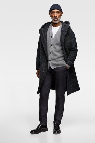 500+ Chill Weather Outfits For Men: This pairing of a black overcoat and black chinos is truly jaw-dropping, but it's also very easy to wear. Why not complement this ensemble with a pair of black leather derby shoes for an extra touch of style?