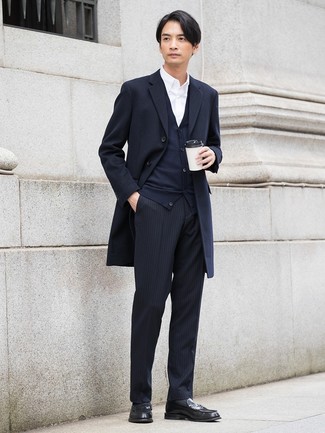 We're loving how this combo of a navy overcoat and black vertical striped dress pants instantly makes you look polished and dapper. Introduce black leather loafers to the equation for maximum style points.