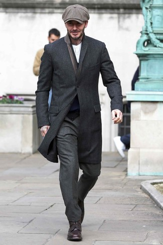 David Beckham wearing Black Overcoat, Navy Cardigan, White Vertical Striped Long Sleeve Henley Shirt, Charcoal Wool Dress Pants