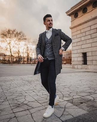 Charcoal Cardigan Outfits For Men: This casual combination of a charcoal cardigan and navy vertical striped chinos is perfect when you need to look nice but have no time to dress up. When this look is too much, dress it down by rounding off with white canvas low top sneakers.