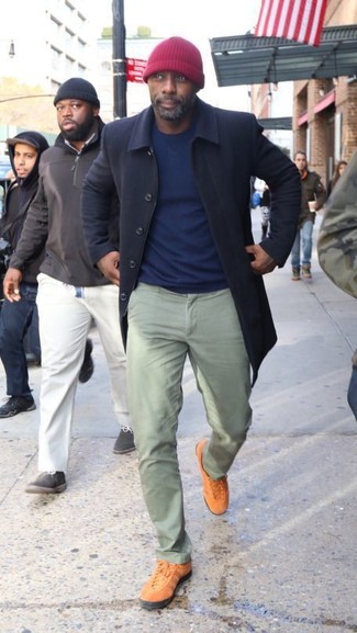 Idris Elba wearing Navy Overcoat, Navy Crew-neck Sweater, Mint Chinos, Tobacco Low Top Sneakers
