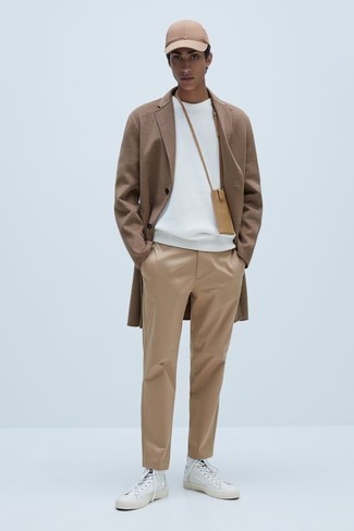 Tan Leather Messenger Bag Outfits: A camel overcoat and a tan leather messenger bag are a nice look that will effortlessly carry you throughout the day and into the night. Let your styling savvy really shine by finishing this getup with a pair of white canvas high top sneakers.