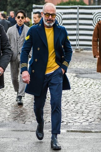 Mustard Crew-neck Sweater Outfits For Men: You'll be surprised at how super easy it is to get dressed this way. Just a mustard crew-neck sweater and navy dress pants. A pair of black leather loafers is a tested footwear style that's full of character.