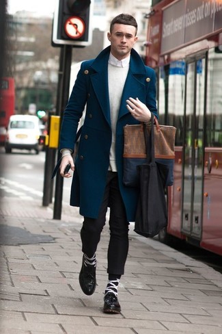 A blue overcoat and black chinos are the perfect way to introduce some manly elegance into your current off-duty collection. You can get a bit experimental on the shoe front and complement this look with black leather derby shoes.