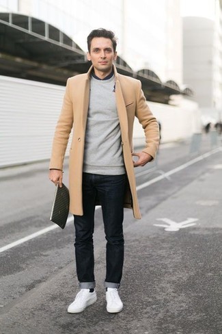 Get into dapper mode in a camel overcoat and black jeans. You know how to play it down: white low top sneakers.