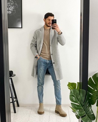 Beige Suede Chelsea Boots Outfits For Men: Dial up your fashion game in this combo of a grey overcoat and blue jeans. Finishing off with beige suede chelsea boots is the simplest way to bring a little classiness to this outfit.