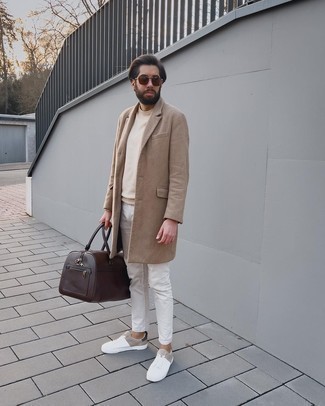 Dark Brown Leather Holdall Outfits For Men: This combination of a camel overcoat and a dark brown leather holdall spells versatility and stylish practicality. Add a pair of white leather low top sneakers to the equation and you're all done and looking spectacular.