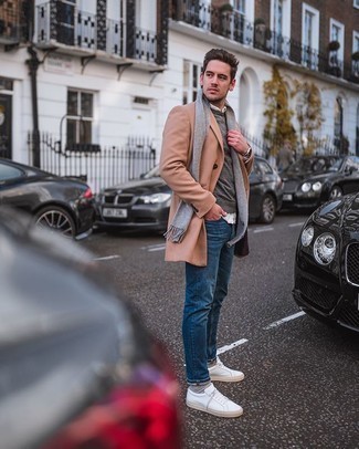 Camel Overcoat Outfits: Marry a camel overcoat with blue jeans to achieve a proper and elegant menswear style. You could follow a more casual route when it comes to footwear by finishing with a pair of white canvas low top sneakers.