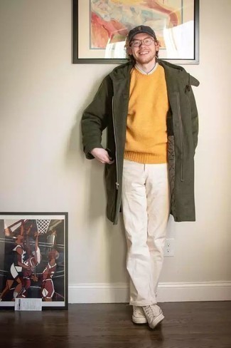 Orange Crew-neck Sweater Outfits For Men: This pairing of an orange crew-neck sweater and white chinos is on the off-duty side yet it's also seriously stylish and extra stylish. Our favorite of a multitude of ways to complete this ensemble is with a pair of white canvas high top sneakers.