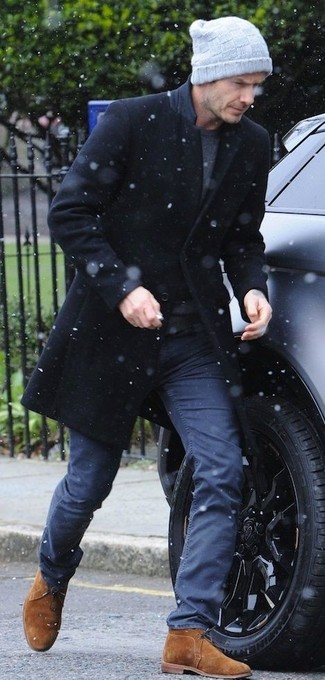 David Beckham wearing Black Overcoat, Charcoal Crew-neck T-shirt, Navy Chinos, Tobacco Suede Desert Boots
