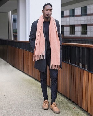 Pink Scarf Outfits For Men: A charcoal overcoat and a pink scarf married together are a perfect match. If you don't know how to finish, introduce a pair of tan leather low top sneakers to the mix.