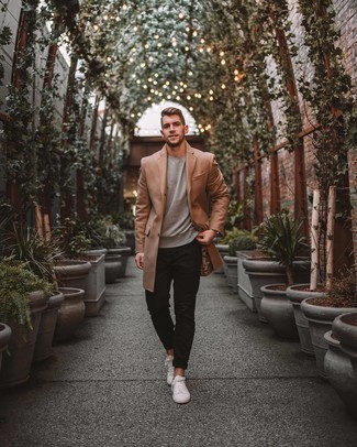 Camel Overcoat Warm Weather Outfits: Such pieces as a camel overcoat and black chinos are the ideal way to introduce some class into your casual rotation. Complete this getup with white canvas low top sneakers to bring a sense of stylish effortlessness to this outfit.